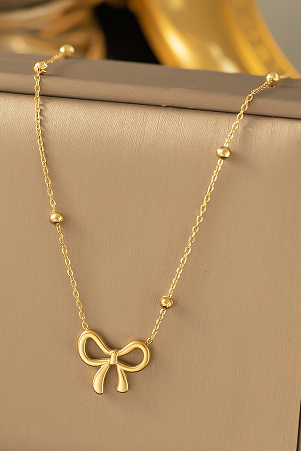 Gold Elegant Bow Design Plated Studded Earrings